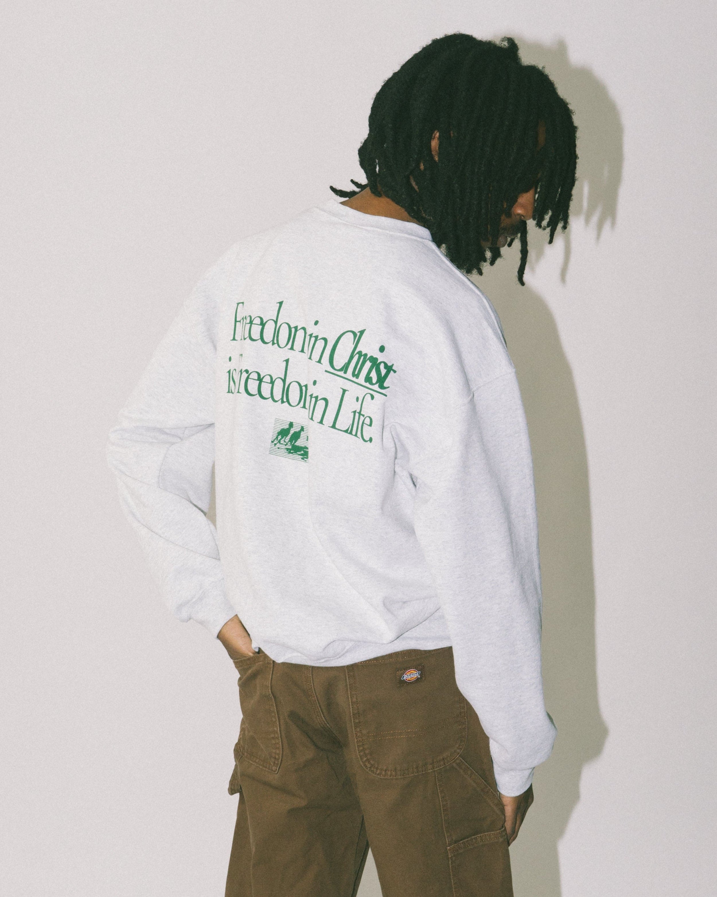 Freedom in Christ Crewneck Sweatshirt on a model by NHIM Apparel Christian clothing brand