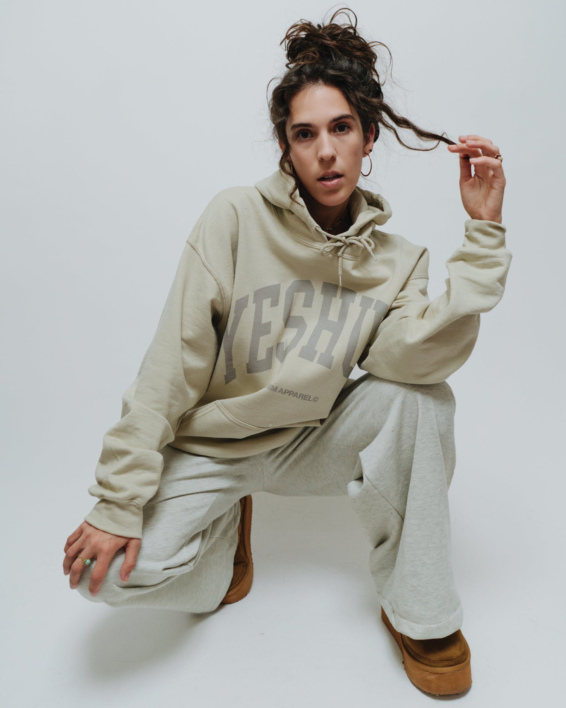 The Yeshua Hoodie in sand by NHIM Apparel. Premium, ethically sourced, made in the USA Christian sweatshirts & apparel. All glory to Yeshua!