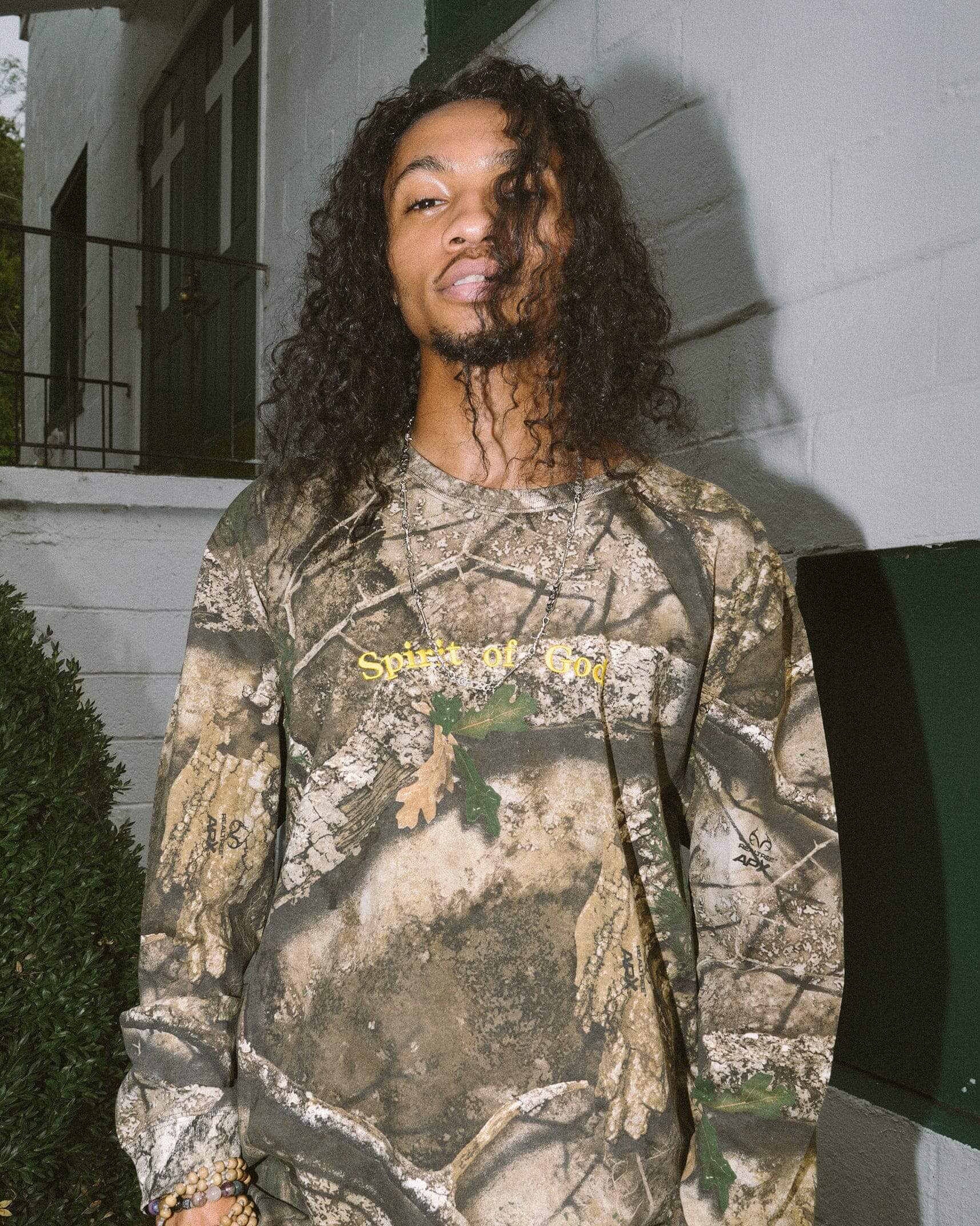 man wearing camo long sleeve christian shirt in atlanta, georgia