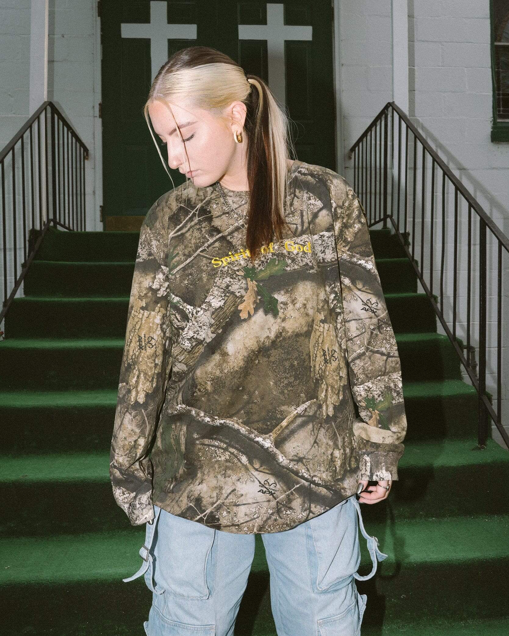 woman wearing camo long sleeve christian shirt in atlanta, georgia