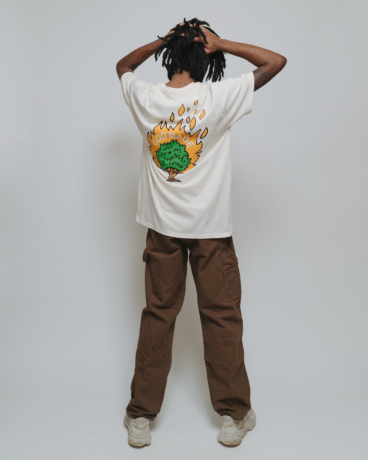 Burning Bush T-Shirt by NHIM APPAREL christian clothing brand. natural colored shirt with burning bush saying "GOD MADE"