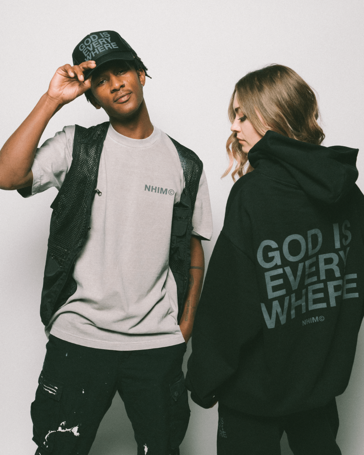 GOD IS EVERYWHERE PREMIUM CHRISTIAN APPAREL COLLECTION. Black trucker hat and black hoodie by NHIM APPAREL